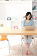 a young asian woman using laptop computer