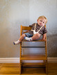 Foto: Bored baby in highchair Bored baby in highchair