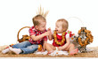 two children eating cookies