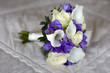 wedding bouquet on a bed