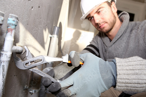 Photo: plumber working plumber working