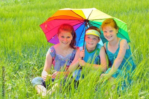 Photo: kids with umbrella on field kids with umbrella on field