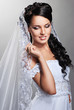 beautiful bride is standing in wedding dress