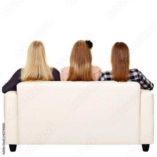 Photo: Women sitting on sofa - rear view Women sitting on sofa - rear view