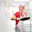 portrait of young cook man cooking vegetables at modern building