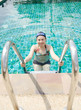 Close up woman swimming in swimming pool.