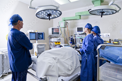 Photo: Surgery room with surgeon and nurses Surgery room with surgeon and nurses