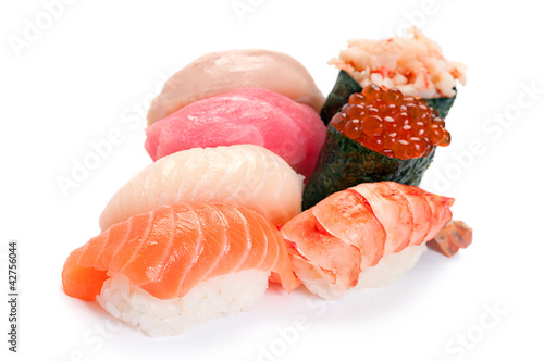 Photo: Assorted Sushi small. On a white background. Salmon, tuna, yello Assorted Sushi small. On a white background. Salmon, tuna, yello