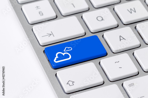 Photo: Keyboard with blue button showing cloud computing icon Keyboard with blue button showing cloud computing icon