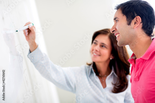 Photo: Teacher helping a student Teacher helping a student
