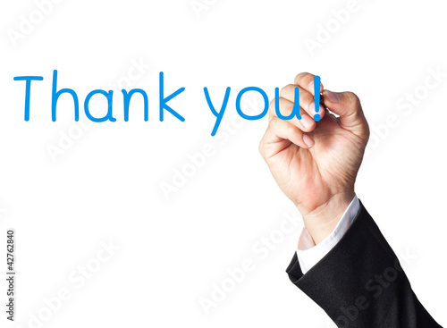 Photo: businessman hand writing thank you on white board businessman hand writing thank you on white board