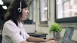 Friendly happy female helpdesk consultant in the office