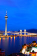 Cityscape in night with famous travel tower near river in Macao,