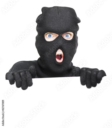Photo: Surprised Robber Holding Blank Security Sign Surprised Robber Holding Blank Security Sign
