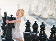 Photo: Baby playing in chess Baby playing in chess