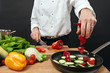 Photo: Chef adding ingredients Chef adding ingredients