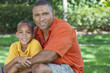Happy African American Father and Son Family Outside