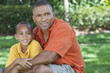 Happy African American Father and Son Family Outside