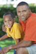 Happy African American Father and Son Family Outside