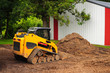 Photo: yellow bulldozer with warehouse yellow bulldozer with warehouse