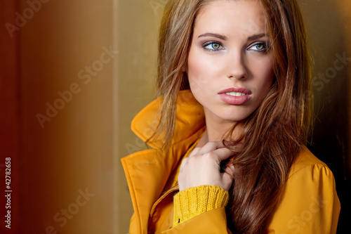 Photo: young brunette woman portrait in autumn color young brunette woman portrait in autumn color