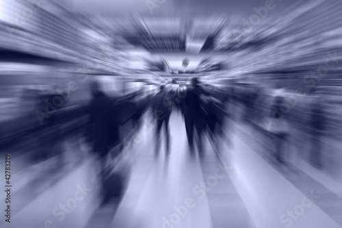 Photo: People walking to the gate of the airport transfer. People walking to the gate of the airport transfer.