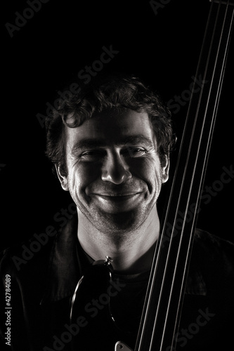 Photo: handsome musician griining widely handsome musician griining widely