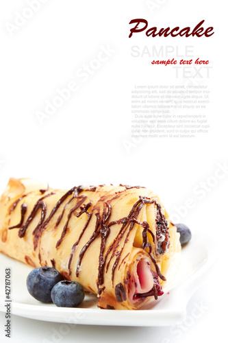 Photo: Buttermilk Pancake with blueberries isolated on a white Buttermilk Pancake with blueberries isolated on a white
