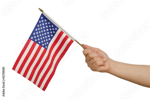 Photo: Hand holding american flag on white Hand holding american flag on white