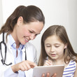Child and doctor with tablet computer