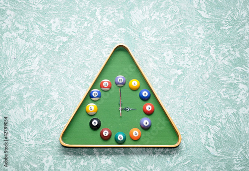 Photo: Wall clock in snooker hall in triangle frame shape Wall clock in snooker hall in triangle frame shape