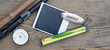Fly fishing rod with  photo frame on wood background
