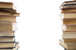 Photo: two vertical stacks of books on a white background two vertical stacks of books on a white background