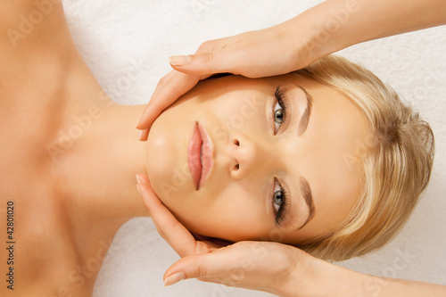 Photo: beautiful woman in massage salon beautiful woman in massage salon
