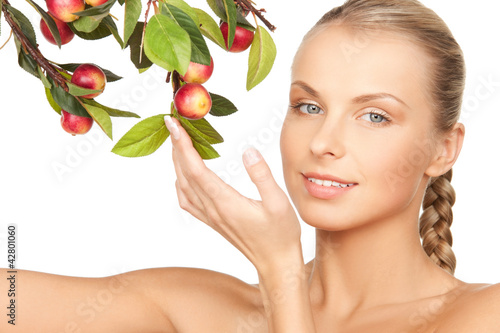 Photo: lovely woman with apple twig lovely woman with apple twig