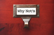 Lustrous Wooden Cabinet with Why Not's File Label