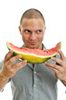 Handsome male holding watermelon. Isolated on white