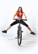 Photo: a woman and a mountain bike a woman and a mountain bike