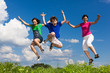 Active family - mother and kids running, jumping outdoor