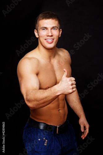 Photo: Portrait of sexy man smiling in camera Portrait of sexy man smiling in camera