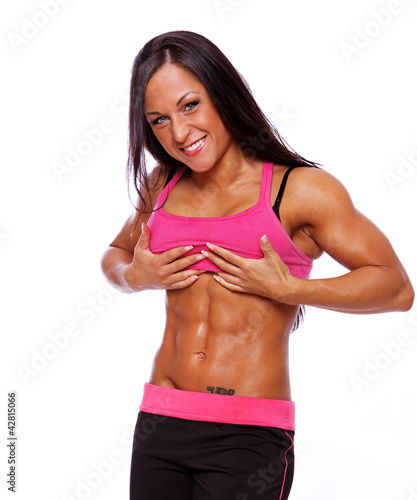 Photo: Portrait of sexy woman posing in studio in sportwear Portrait of sexy woman posing in studio in sportwear