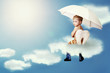 Little angel  sitting on the cloud