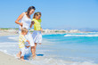 Happy family on tropical beach