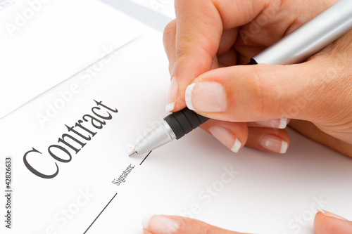 Photo: Extreme close up of hand signing. Extreme close up of hand signing.