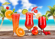 Summer cocktails with blur beach on background