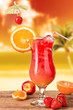 Summer cocktail in sunset with blur beach on background