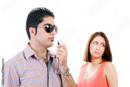 Photo: Private bodyguard with woman client in background Private bodyguard with woman client in background