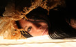 Foto: Reclining girl in straw hat. Reclining girl in straw hat.