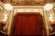 Old theater stage and red curtain