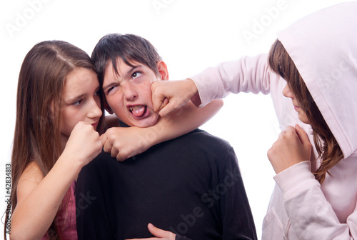 Photo: Two teenage girls beating teenage boy Two teenage girls beating teenage boy